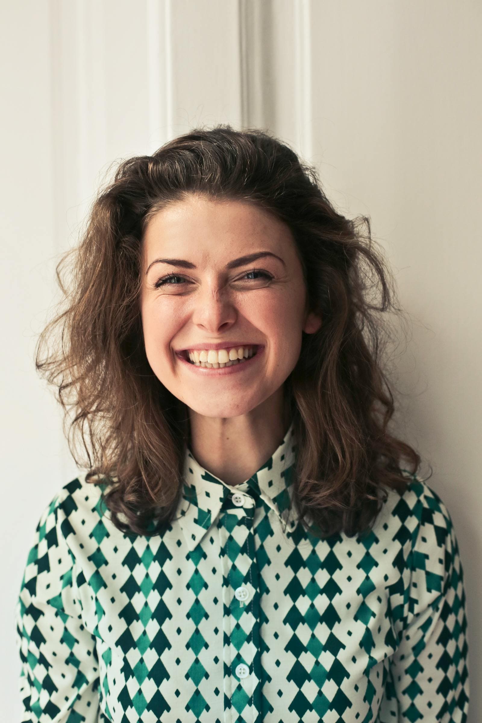 Happy professional smiling while working at a laptop